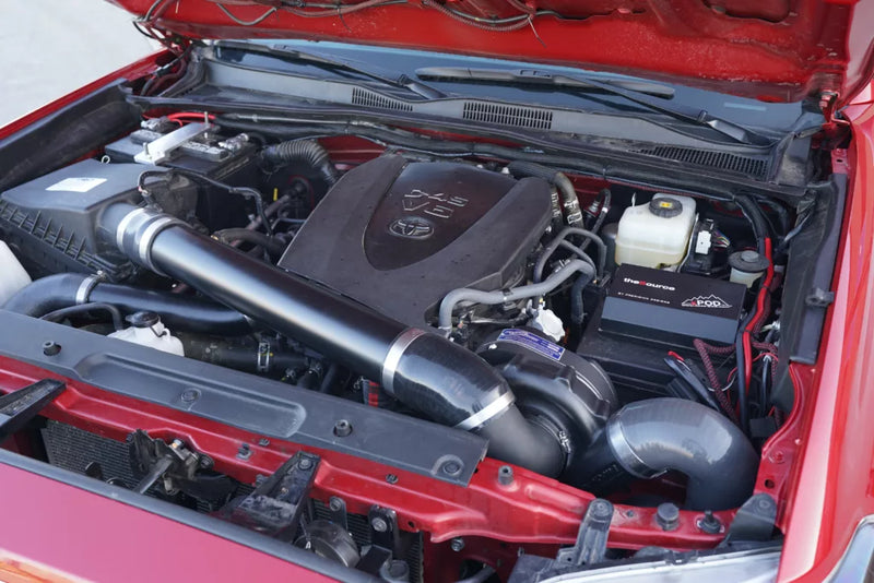 ProCharger Toyota Tacoma 3.5L installation reference. Appearance varies with chosen finish and vehicle configuration; pictured vehicle and unrelated accessories are not included.