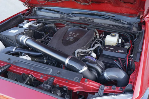 ProCharger Toyota Tacoma 3.5L installation reference. Appearance varies with chosen finish and vehicle configuration; pictured vehicle and unrelated accessories are not included.