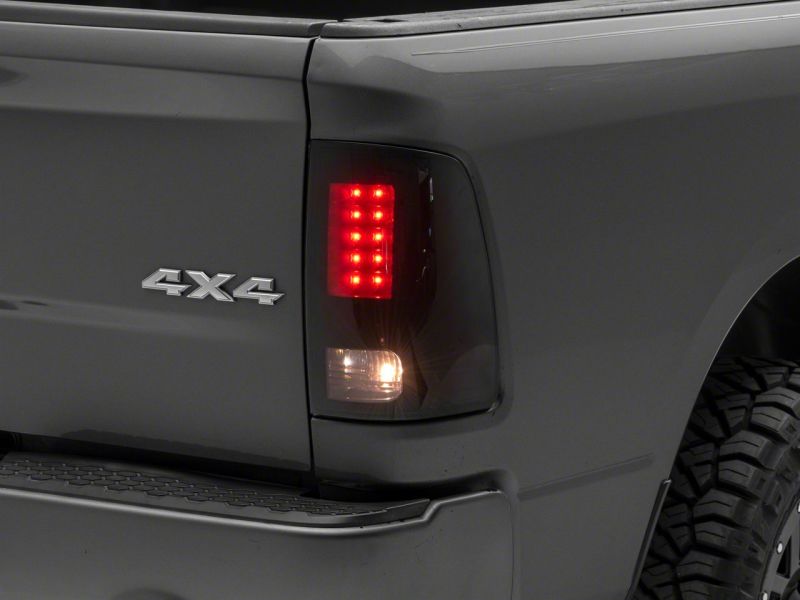 Raxiom 09-18 Dodge RAM 1500/2500/3500 Axial Series LED Tail Lights- Black Housing- Smoked Lens
