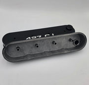 Underside of tall GM LS 427 Stroker aluminum valve covers showing center-bolt mounting bosses